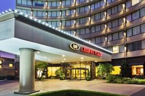 A hotel entrance with a modern design, featuring a prominent sign for 'Crowne Plaza.' - Crowne Plaza Portland Downtown Convention Center by IHG (Portland)