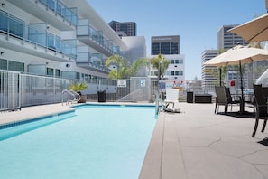 Outdoor pool, open 9:30 AM to 10:00 PM, pool loungers