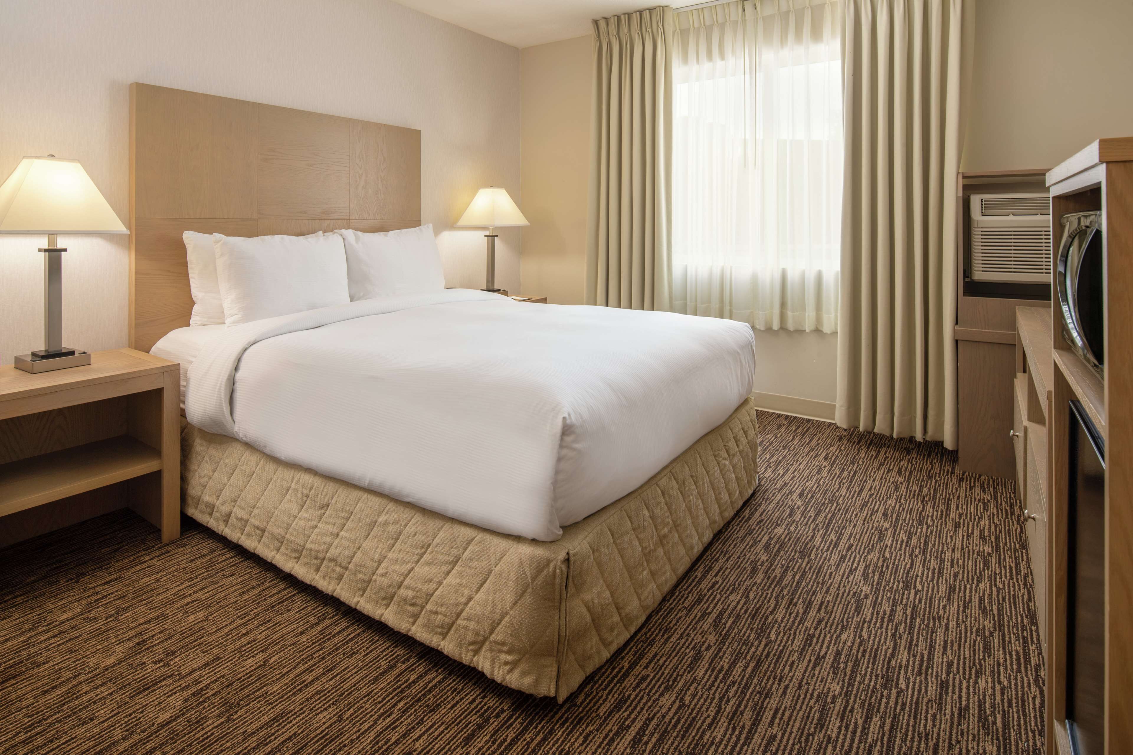 Premium bedding, down comforters, desk, laptop workspace
