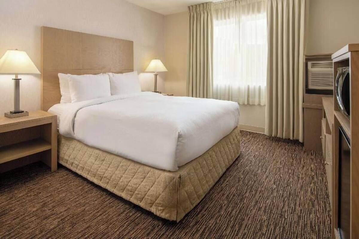 Premium bedding, down comforters, desk, laptop workspace