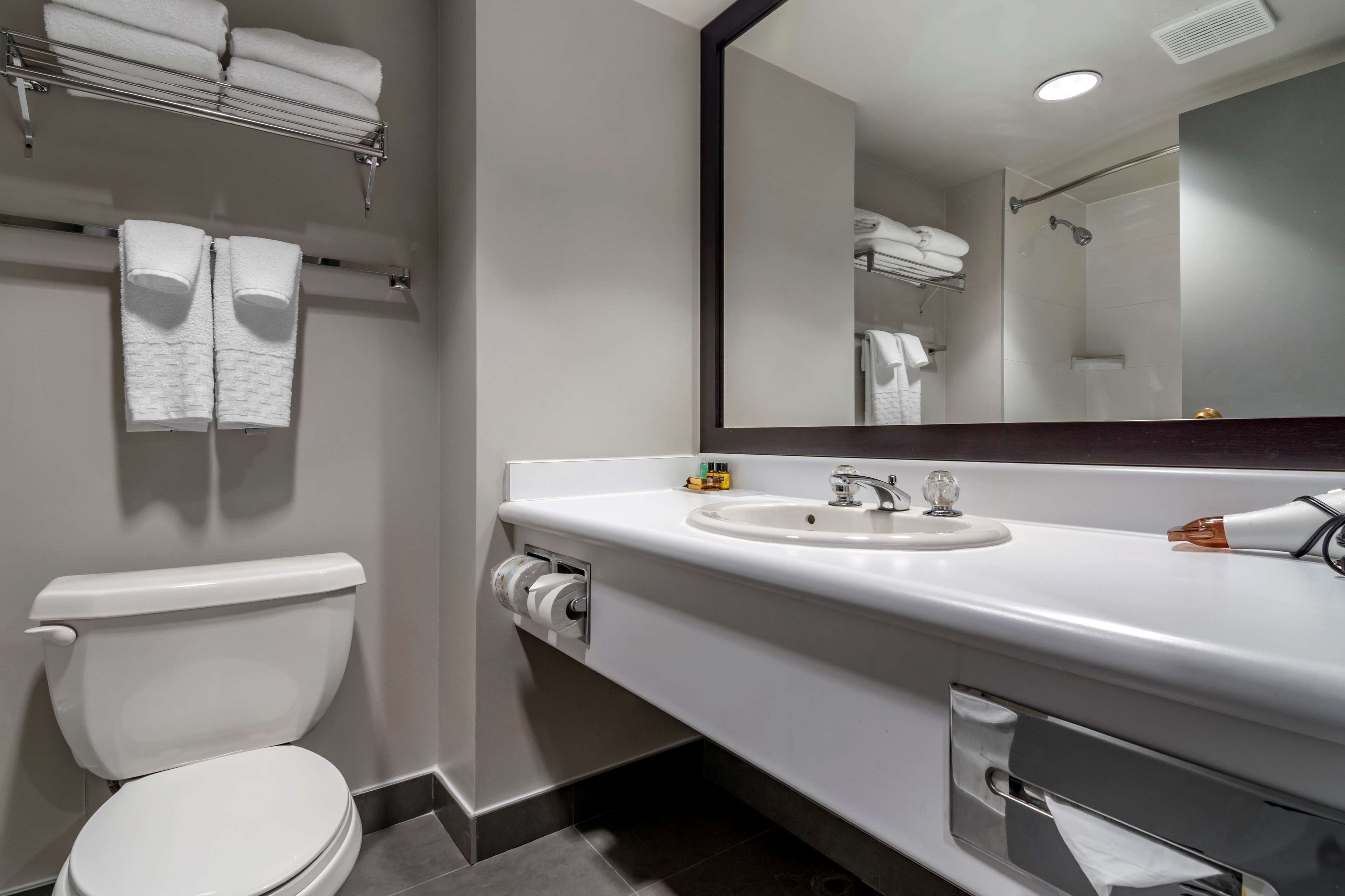 eco-friendly toiletries, hair dryer, towels, soap