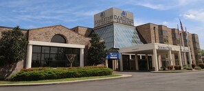 A DoubleTree by Hilton hotel with a brick facade, large windows, and a clear sky. - DoubleTree by Hilton Hotel Jackson (Jackson)