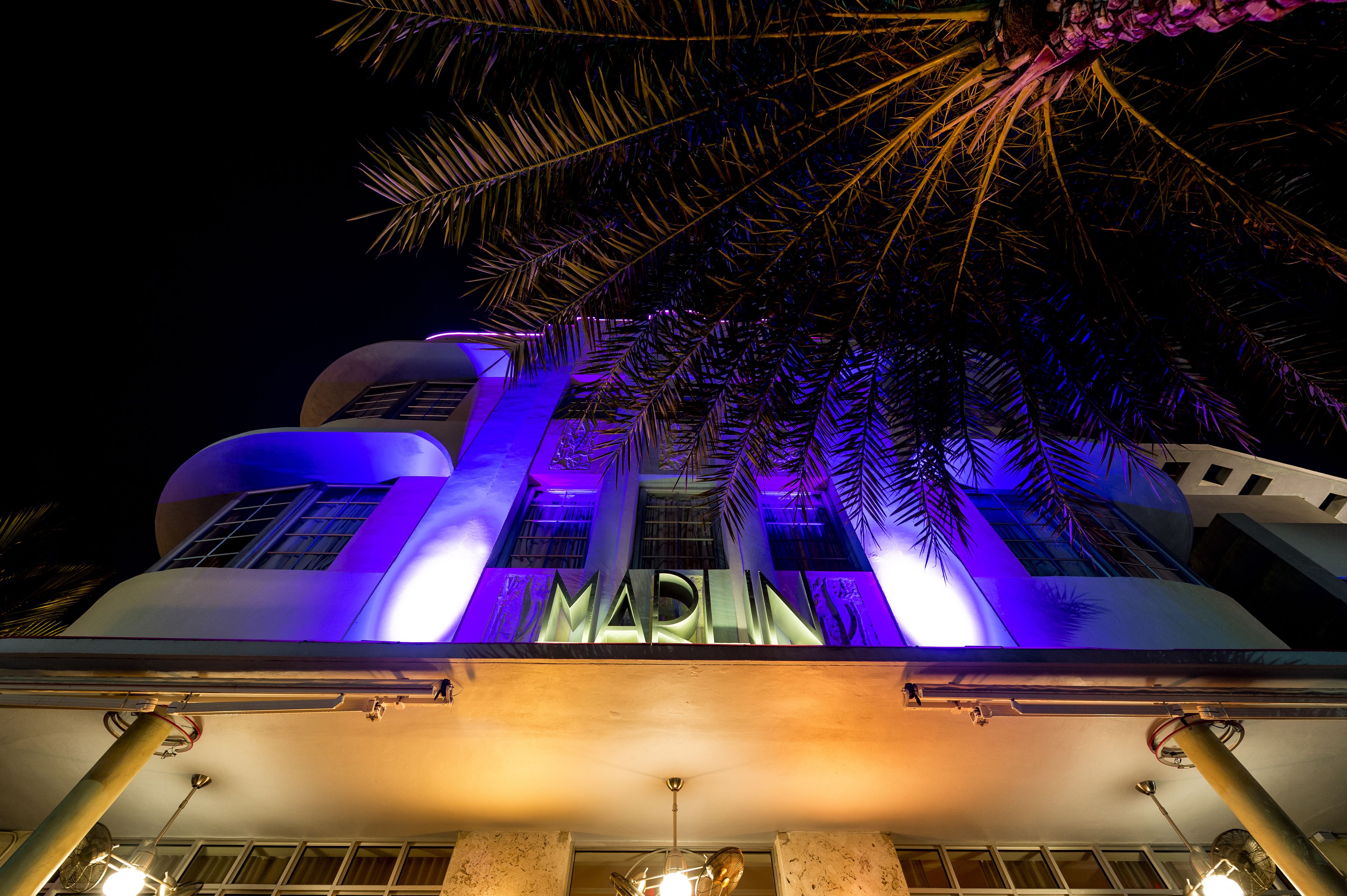 A building with illuminated signage and a modern architectural design.
