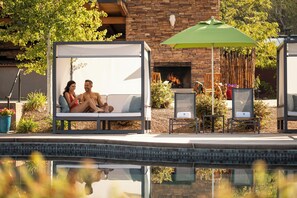 Outdoor pool, open 9:00 AM to 9:00 PM, pool umbrellas, pool loungers