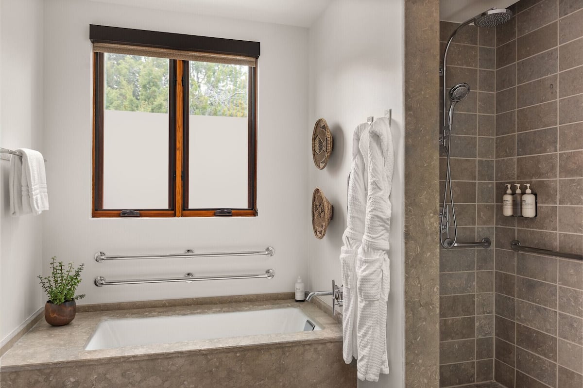 separate bathtub and shower, deep-soaking bathtub, rainfall showerhead