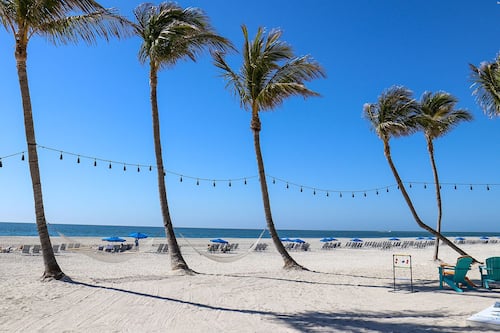 Private beach, white sand, sun loungers, beach umbrellas