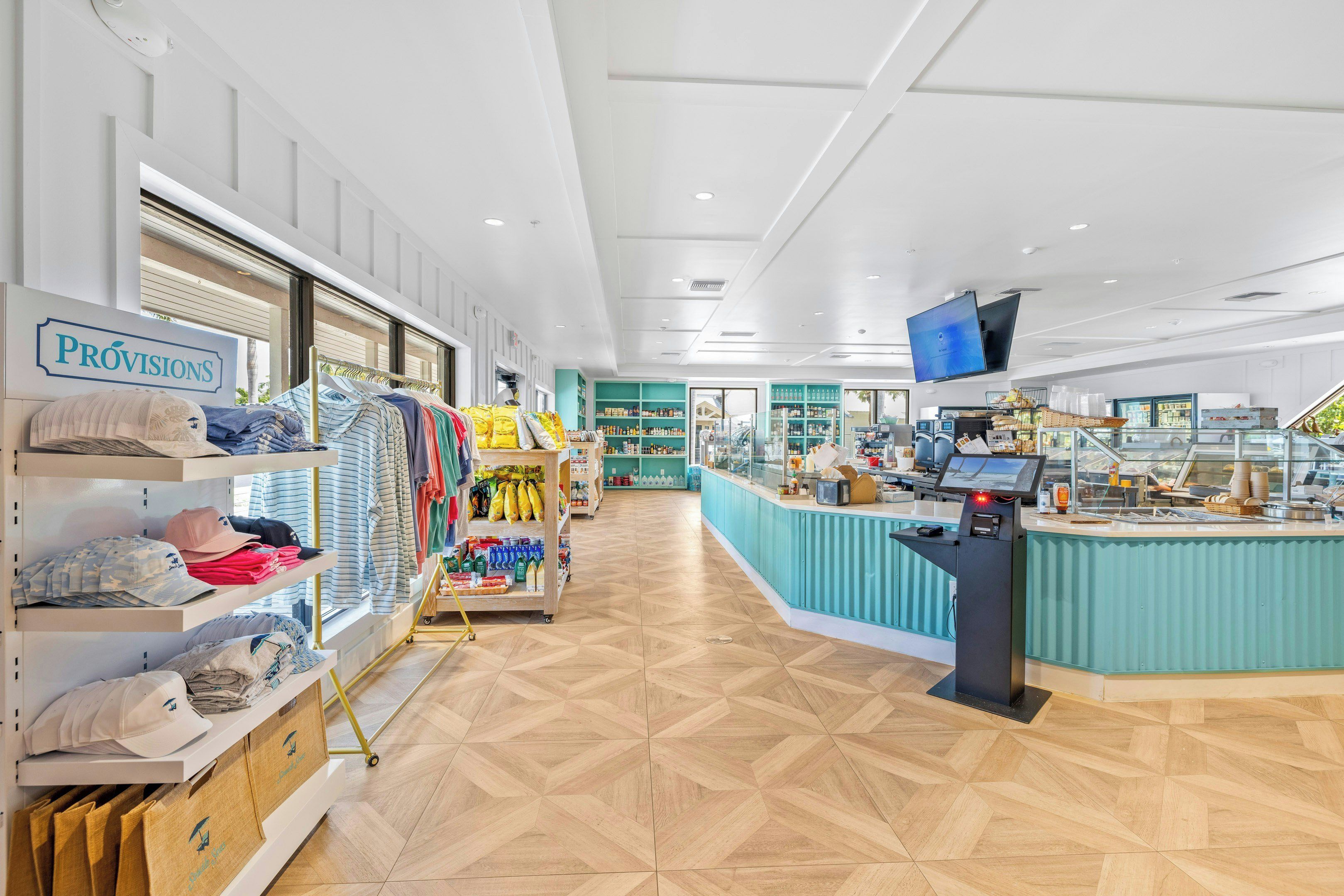 A store interior with clothing racks, shelves, and a checkout counter.