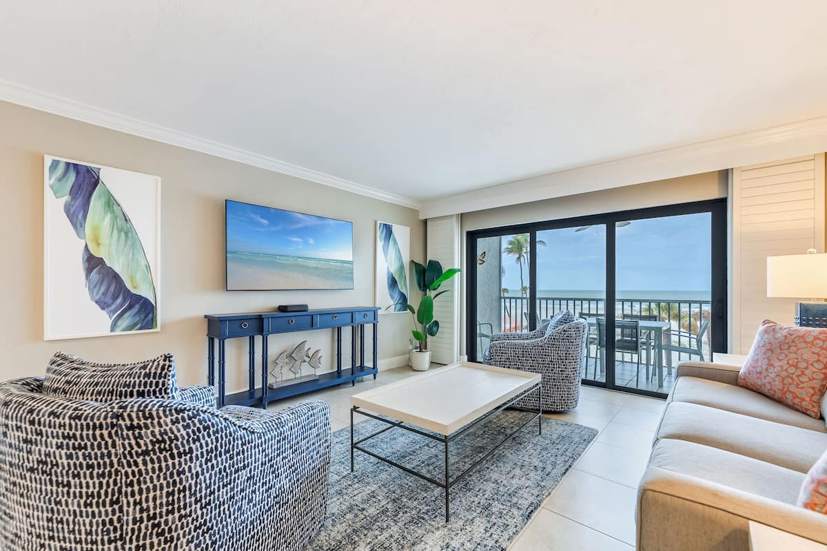 Two Bedroom Beach Villa Deluxe | Living area | 40-inch TV with cable channels