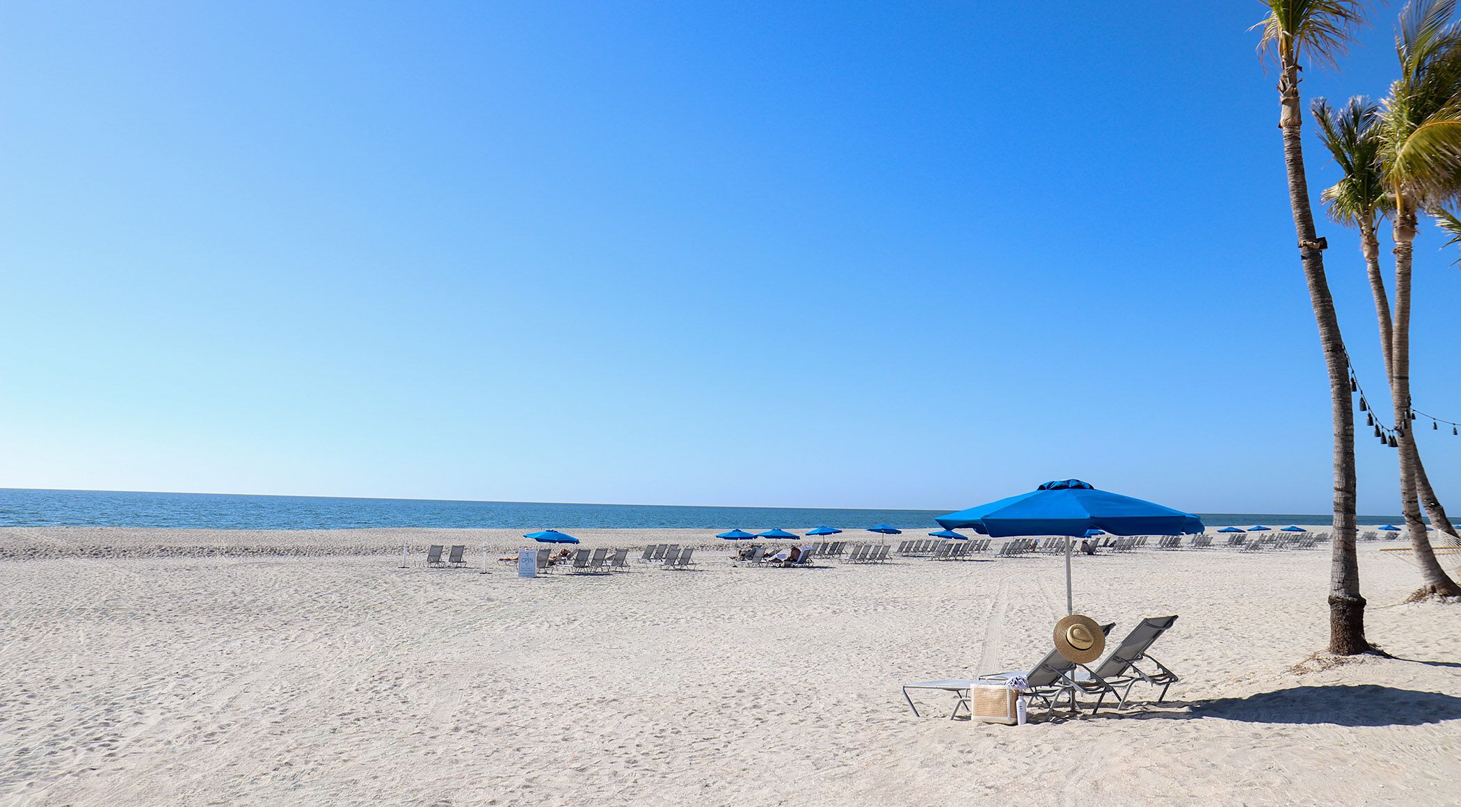 private beach, white sand, sun-loungers, beach umbrellas