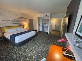 Premium bedding, desk, laptop workspace, blackout drapes