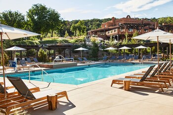 Outdoor pool, cabanas (surcharge), pool umbrellas at Bishops Lodge Auberge Resorts Collection