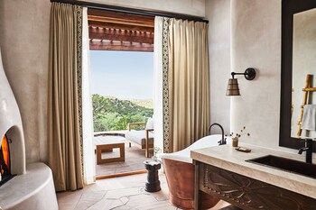 Suite (Kiva) | Bathroom | Designer toiletries, hair dryer, bathrobes, slippers at Bishops Lodge Auberge Resorts Collection