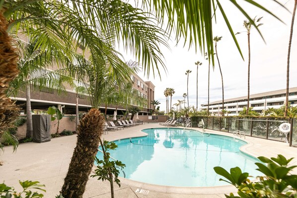 Outdoor pool, open 9:00 AM to 10 PM, pool umbrellas, sun loungers