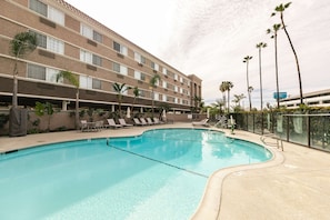 Outdoor pool, open 9:00 AM to 10 PM, pool umbrellas, sun loungers