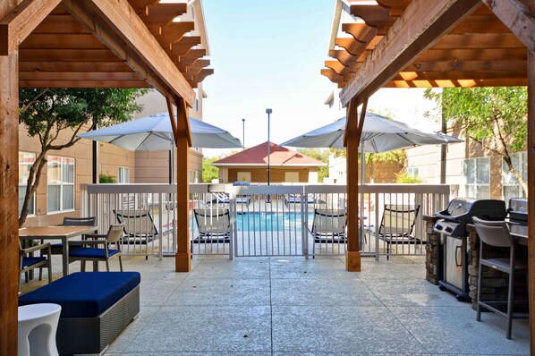 Outdoor pool, open 9:00 AM to 10:00 PM, pool umbrellas, pool loungers