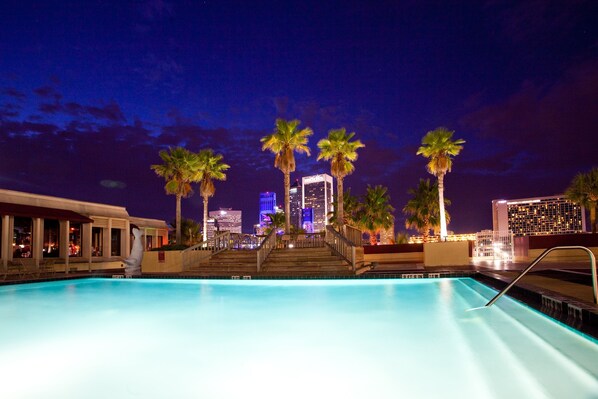 Outdoor pool, open 6 AM to 10:00 PM, free pool cabanas, pool loungers