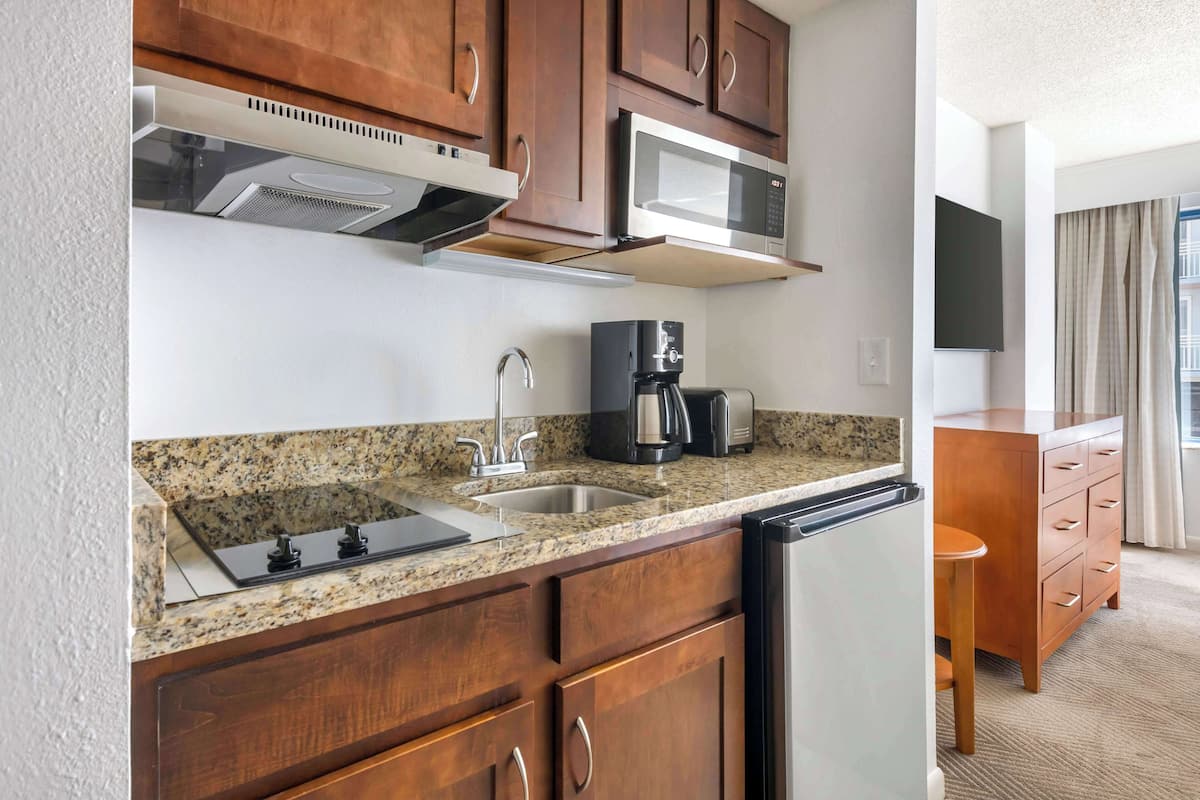 fridge, microwave, coffee/tea maker, cookware/dishes/utensils