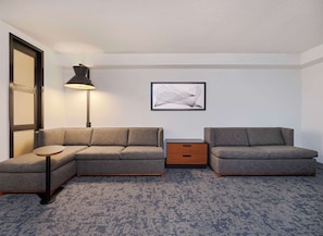 Premium bedding, desk, laptop workspace, blackout curtains