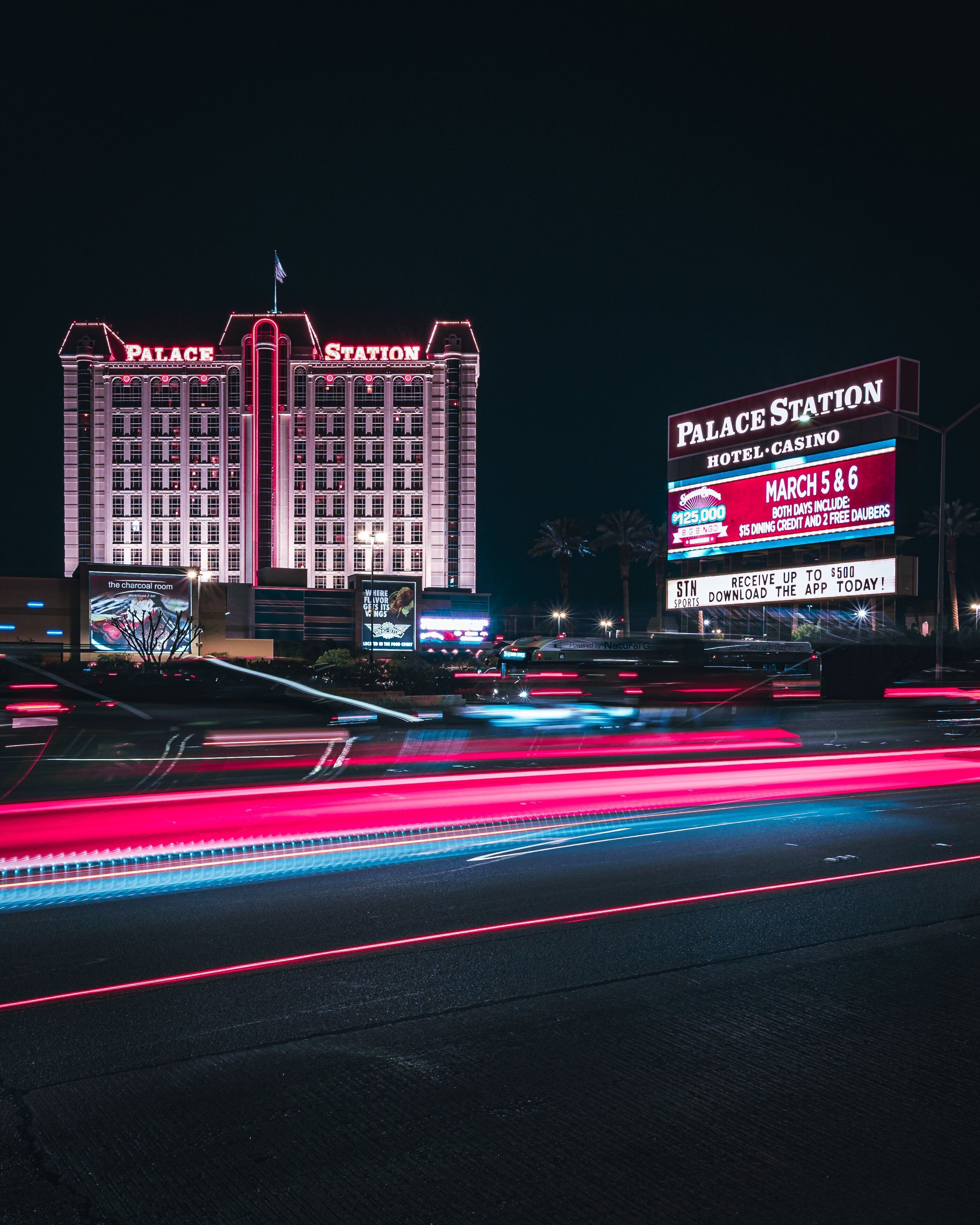 A large hotel and casino building with illuminated signage.