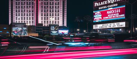 A large hotel and casino building with illuminated signage.