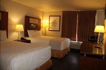 Deluxe Room, 2 Queen Beds (Non Smoking) | Desk, iron/ironing board, free WiFi, bed sheets at Sunrise Inn Hotel