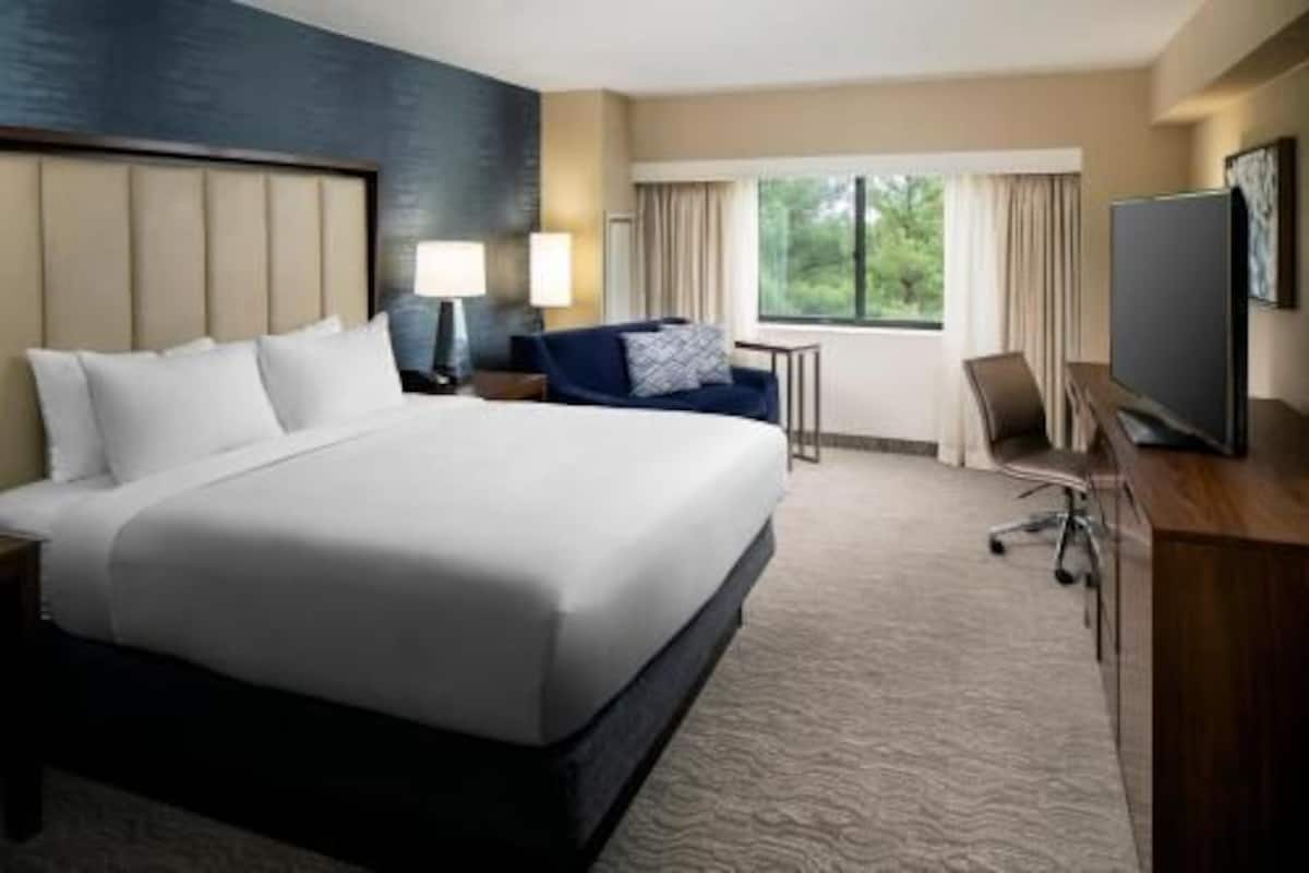 Premium bedding, pillow-top beds, desk, laptop workspace