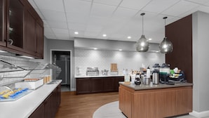 A modern kitchen with a central island, built-in appliances, and a breakfast bar. - Residence Inn by Marriott White Plains Westchester County (White Plains)