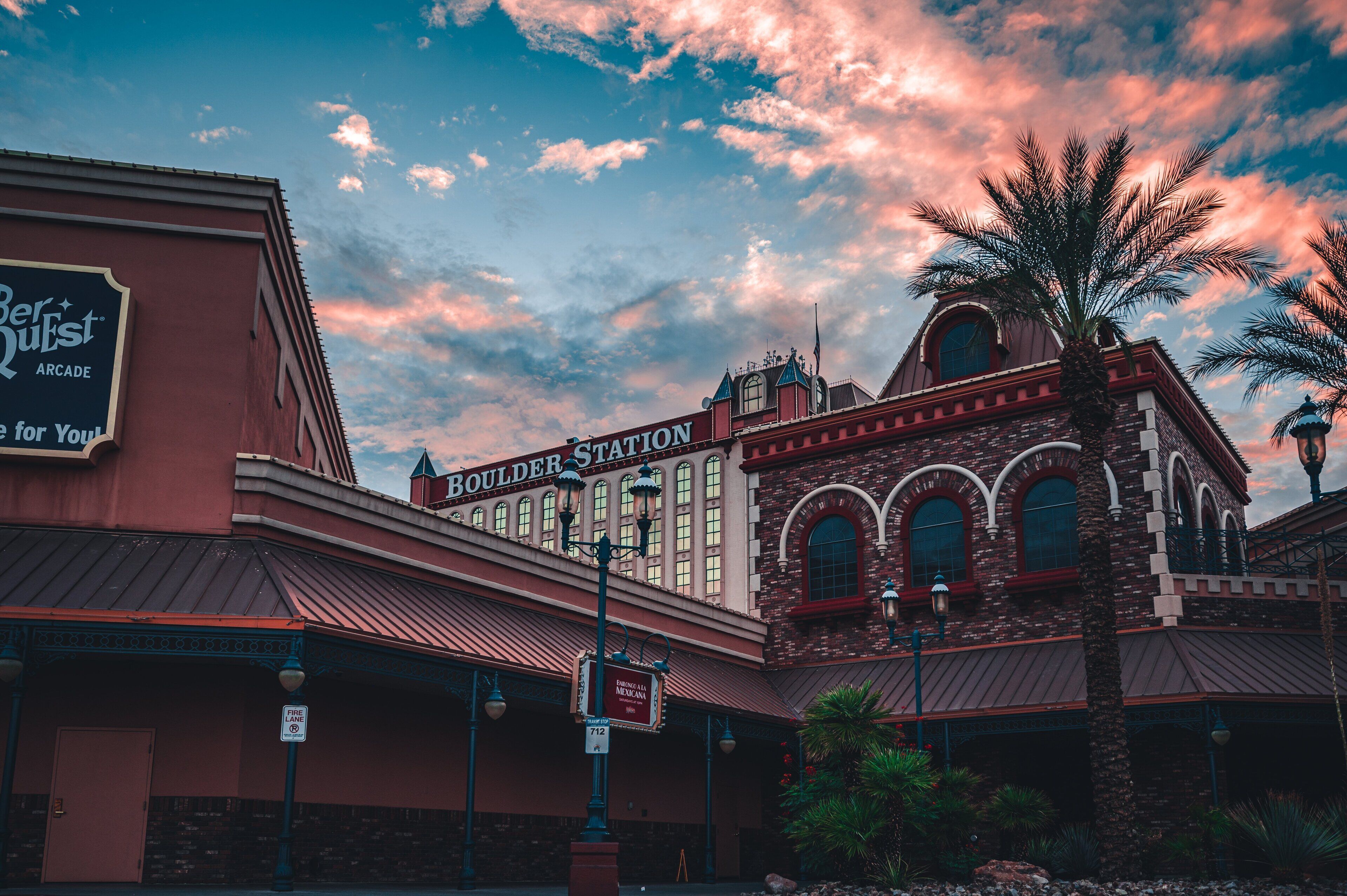 A historic building with a sign reading "Boulder Station Arcade."