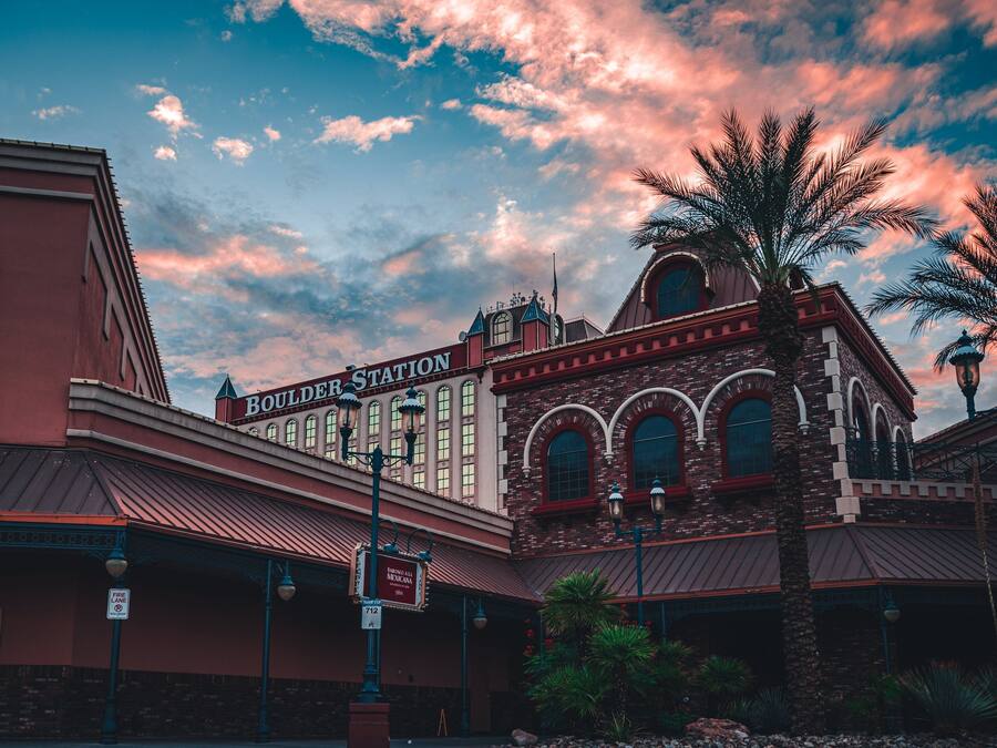 A historic building with a sign reading "Boulder Station Arcade."