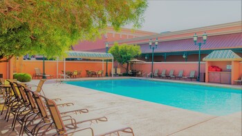 Seasonal outdoor pool, open 9:00 AM to 7:00 PM, pool umbrellas at Boulder Station Hotel and Casino