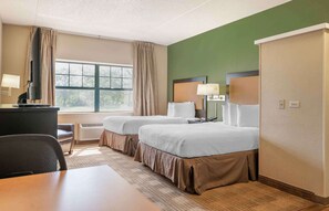 A hotel room with two beds, a desk, a chair, a TV, and a window with curtains. - Extended Stay America Suites Chicago Burr Ridge (Burr Ridge)