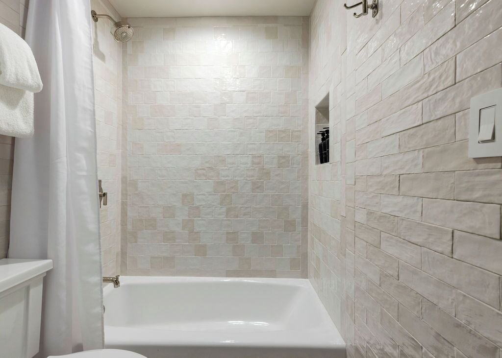 shower, designer toiletries, hair dryer, towels