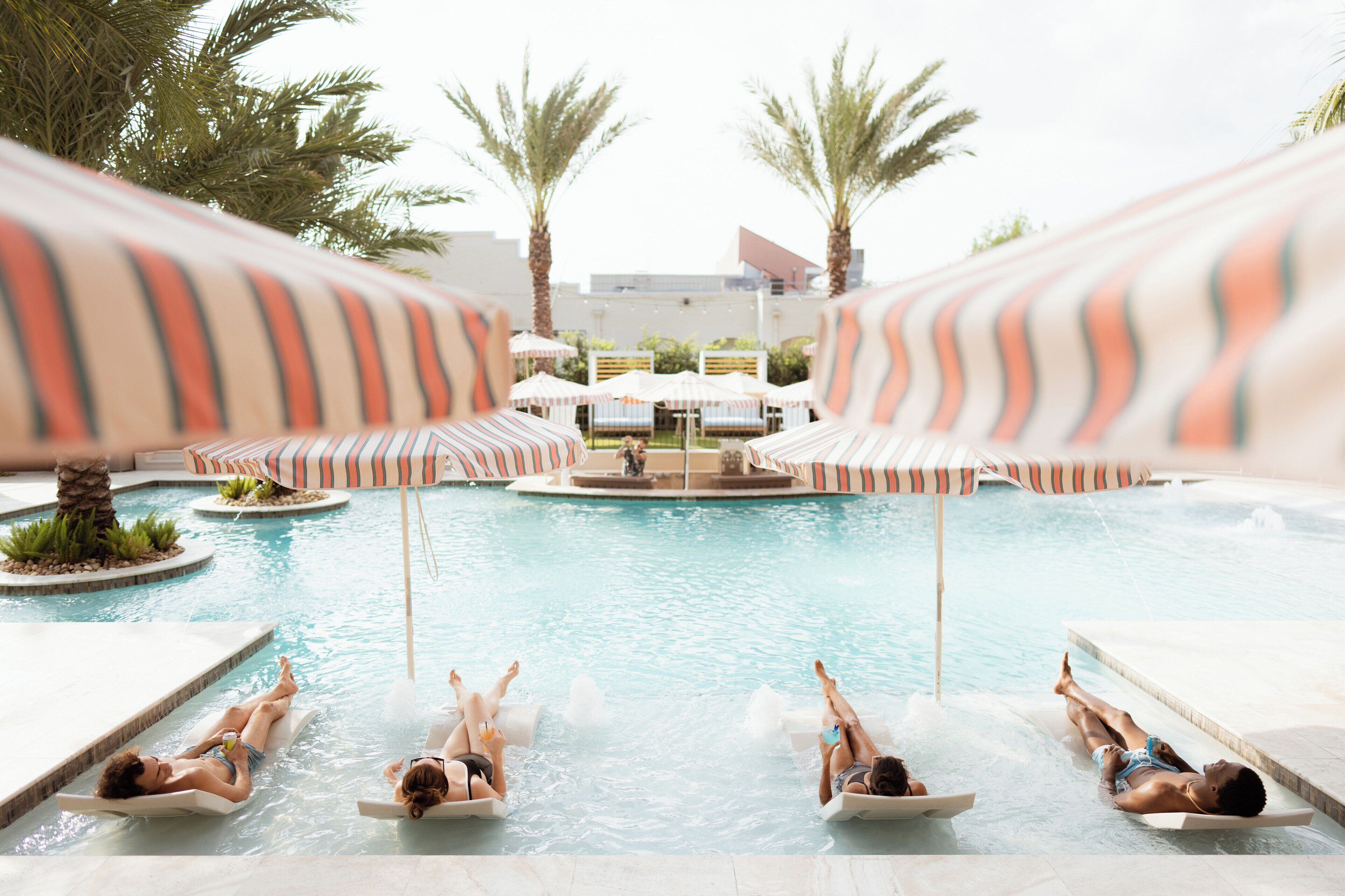 outdoor pool, open 11:00 am to 9:00 pm, pool umbrellas, pool loungers