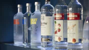 A row of vodka bottles on a shelf.