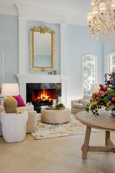 Sitting area in hotel lobby at The Capri Inn