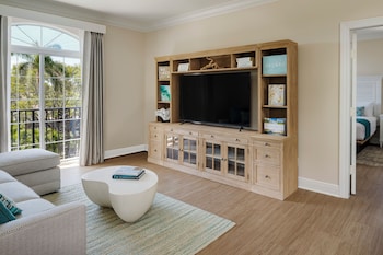 Suite, 1 King Bed | Living area | Flat-screen TV at The Capri Inn