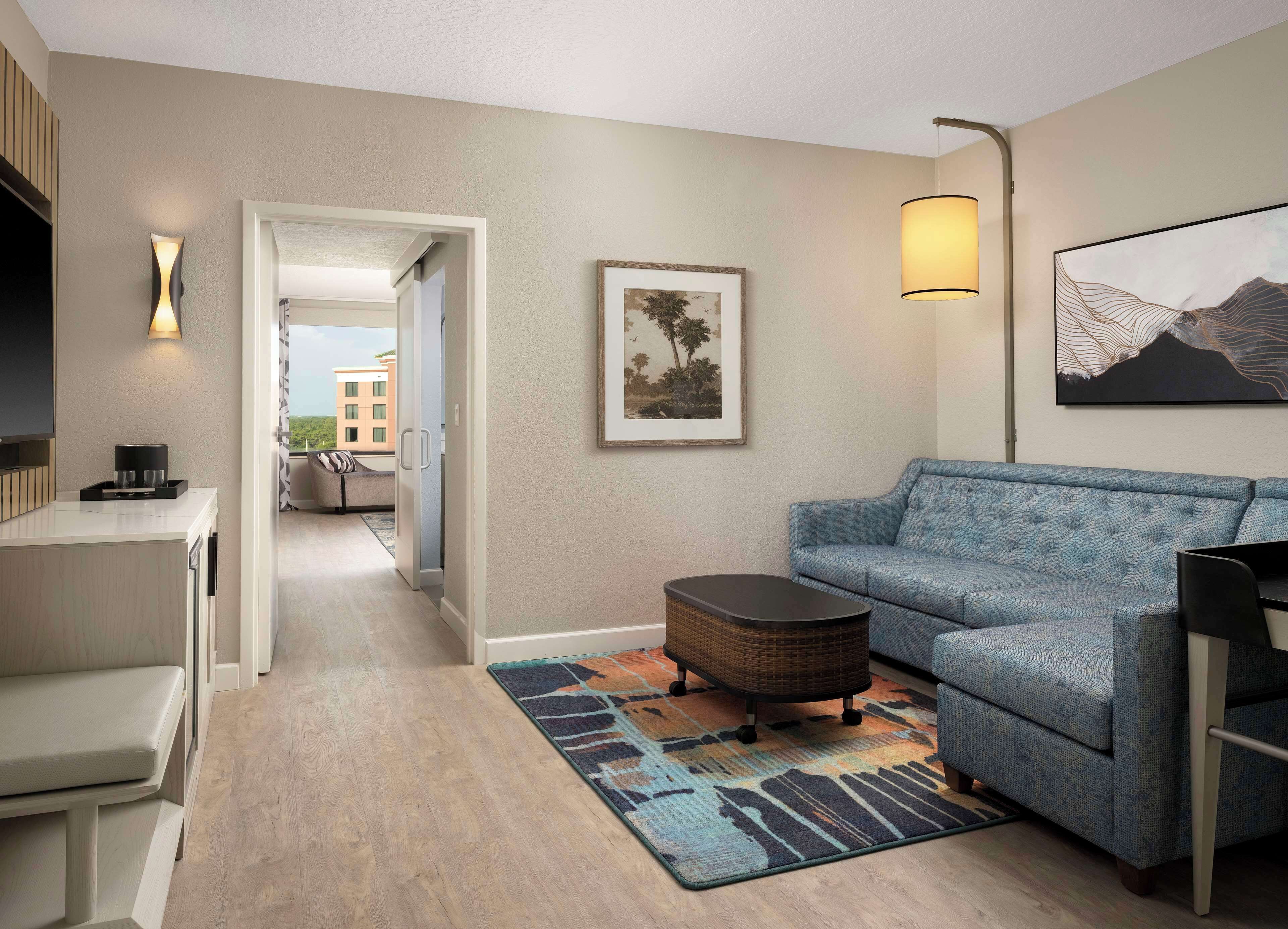 Royal Suite, 1 King Bed, Pool View | Living room | 55-inch flat-screen TV with cable channels