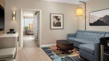 Royal Suite, 1 King Bed, Pool View | Living room | 55-inch flat-screen TV with cable channels