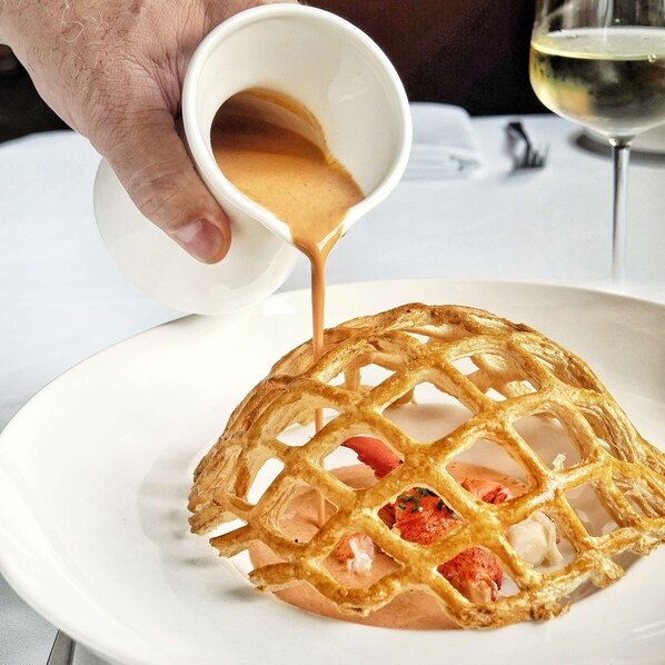 A waffle with strawberries on a plate. - Caribe Royale Orlando, WorldHotels Elite (Orlando)