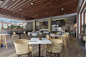 Breakfast, lunch, dinner served; international cuisine, pool views 