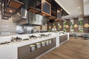 Breakfast, lunch, dinner served; international cuisine, pool views 