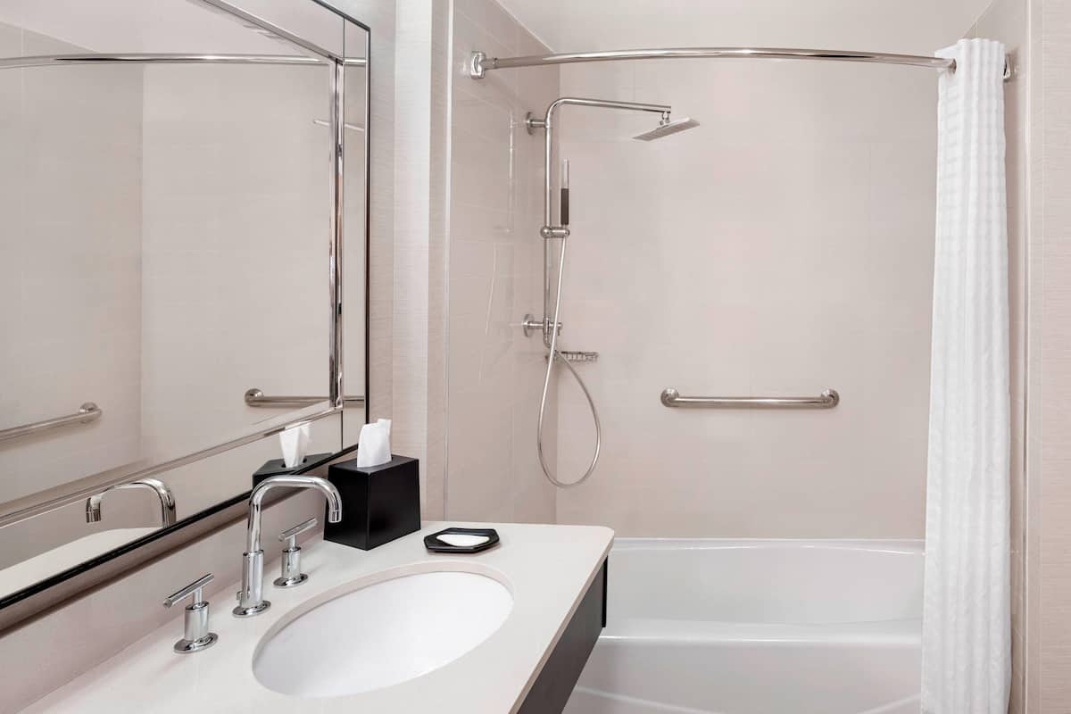 Designer toiletries, hair dryer, towels