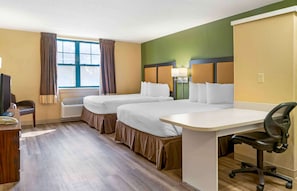 A hotel room with two beds, a desk, a chair, and a television. - Extended Stay America Select Suites Detroit Novi Haggerty Rd (Novi)