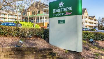 A sign for Home Towne Studios by RedRoof, indicating the property number 200.