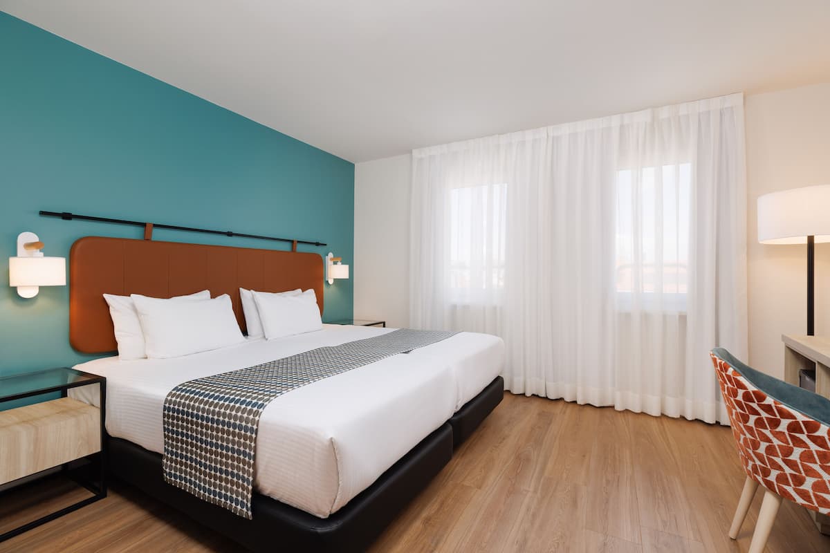 1 habitación, ropa de cama hipoalergénica y minibar