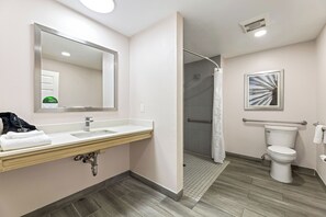 Room, 1 King Bed, Roll-in Shower | Bathroom | Shower, eco-friendly toiletries, hair dryer, towels