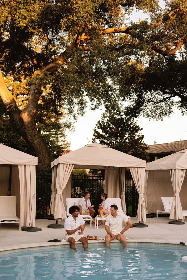 Outdoor pool, open 8 AM to 10:00 PM, free pool cabanas, pool loungers