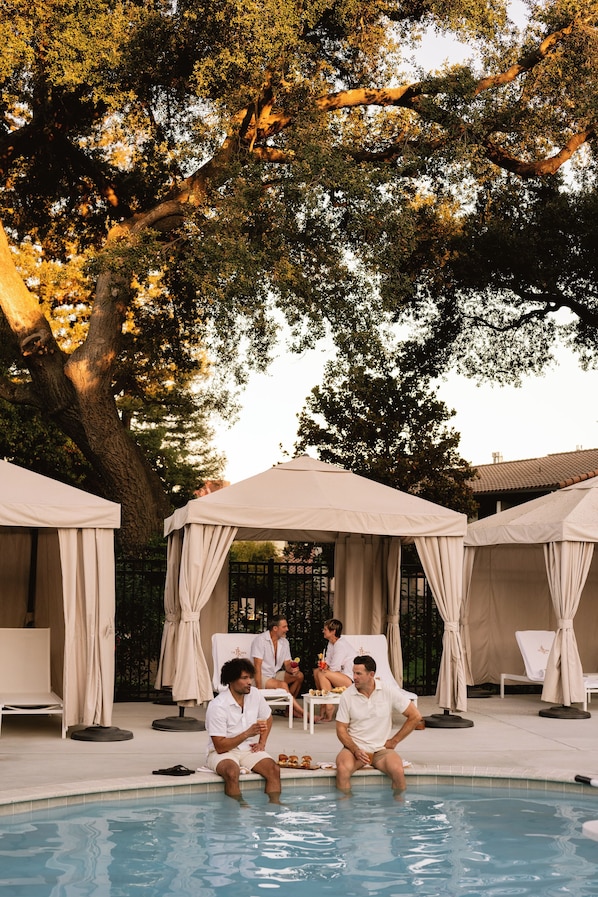 Outdoor pool, open 8 AM to 10:00 PM, free pool cabanas, pool loungers