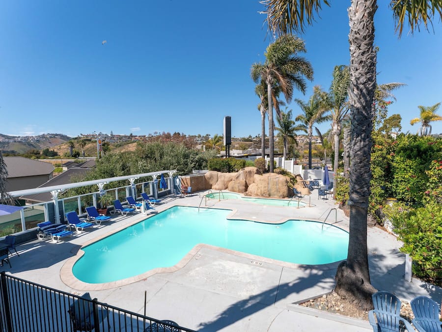 Outdoor pool, a heated pool, open 10:00 AM to 10:00 PM, pool umbrellas
