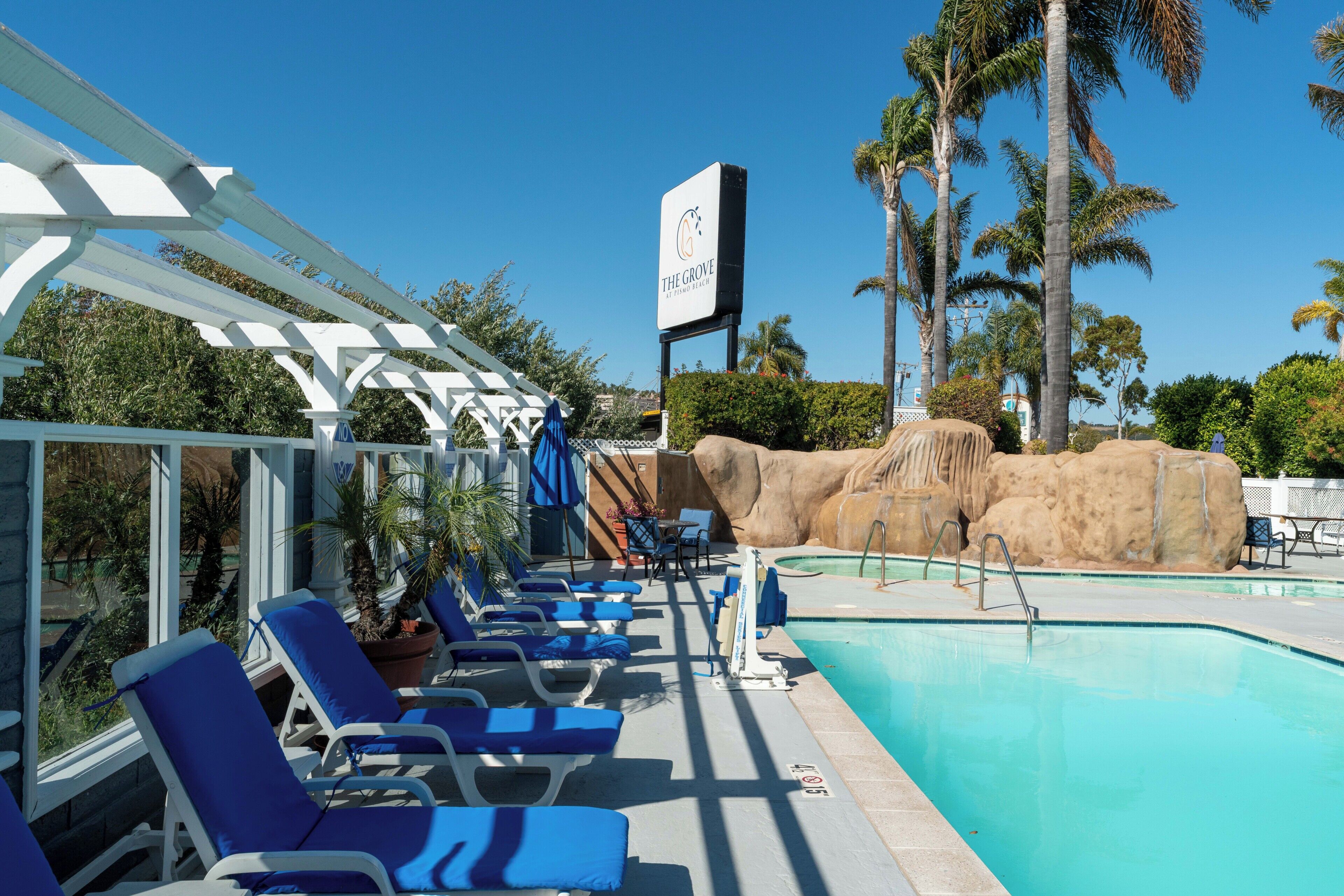 Outdoor pool, a heated pool, open 10:00 AM to 10:00 PM, pool umbrellas